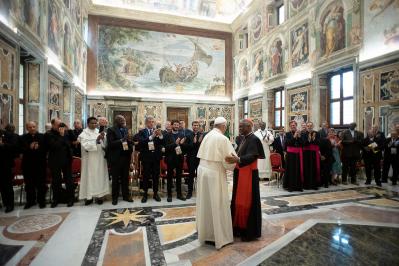 Pope Francis greeting Cardinal Peter Turkson Prefect of the Dicastery for Promoting Integral Human Development